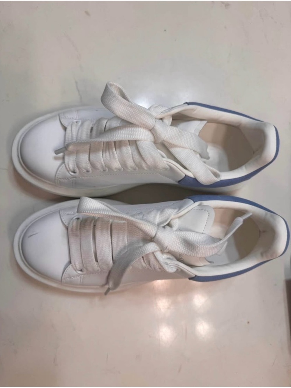 Designer Inspired White Lace-Up Sneakers with Light Blue Heel Accent.